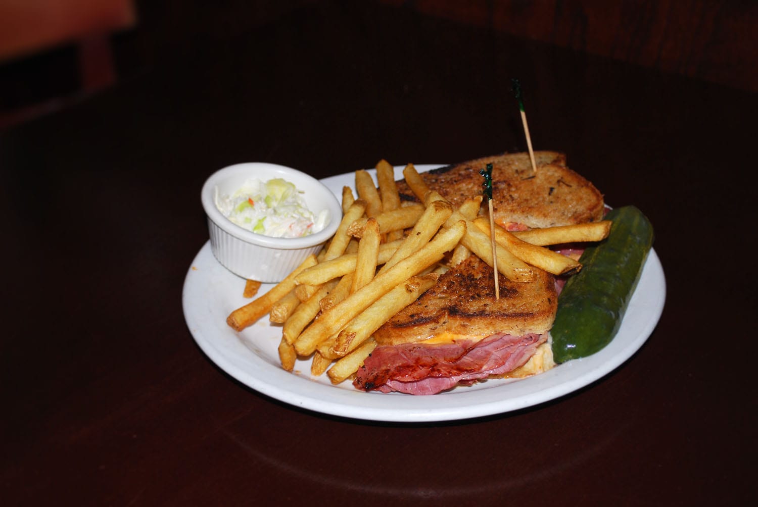 A plate of sandwich and fries